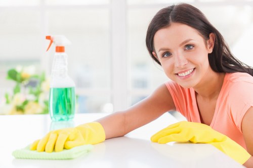 Cleaner maintaining a shared hallway in a Kennington apartment block