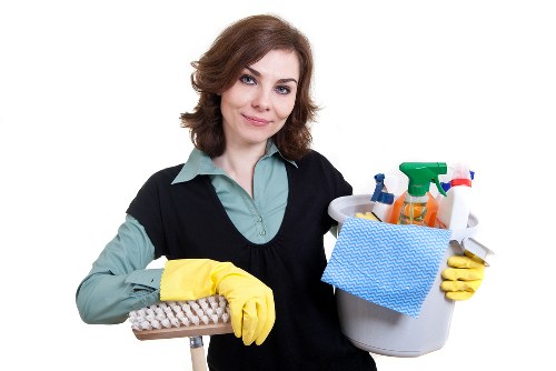 Mopping a communal entrance floor in a south London residential building